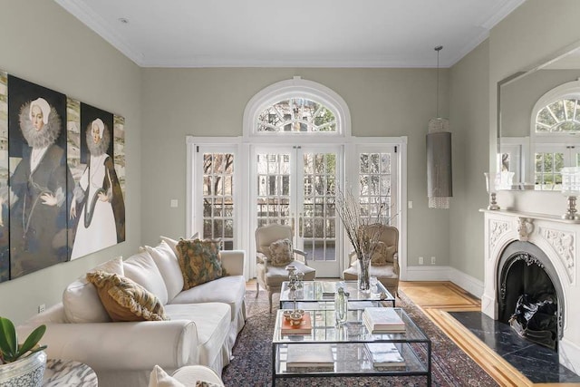 239 E 48th St, New York City, NY 10017 - living area featuring ornamental molding, plenty of natural light, a fireplace with flush hearth, baseboards, and wood finished floors