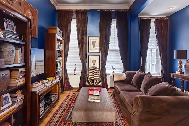 239 E 48th St, New York City, NY 10017 - living area with healthy amount of natural light, crown molding, and light wood finished floors