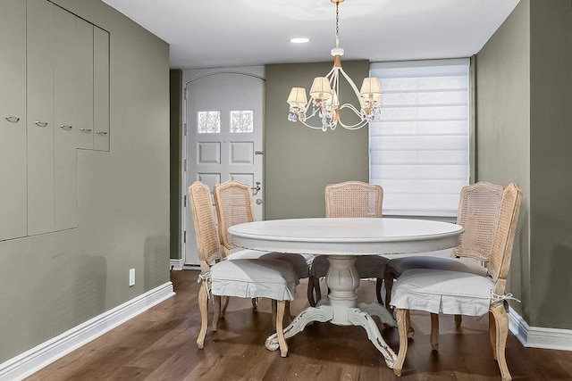 239 E 48th St, New York City, NY 10017 - dining space featuring an inviting chandelier, baseboards, and wood finished floors