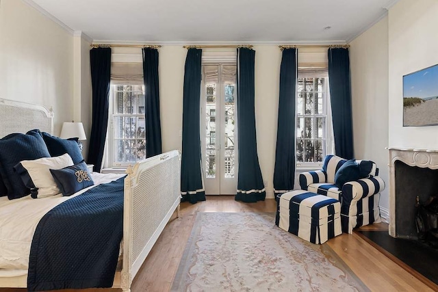 239 E 48th St, New York City, NY 10017 - bedroom featuring ornamental molding, wood finished floors, and multiple windows