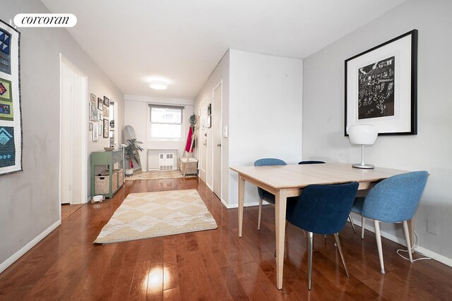 living room with visible vents and wood finished floors