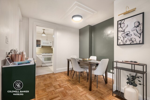 dining room with baseboards