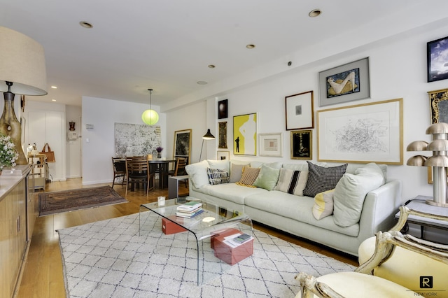 living room featuring wood finished floors and recessed lighting