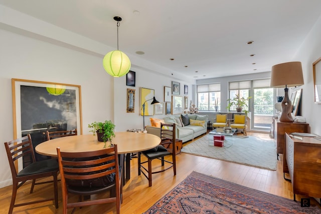 dining area featuring light wood-type flooring