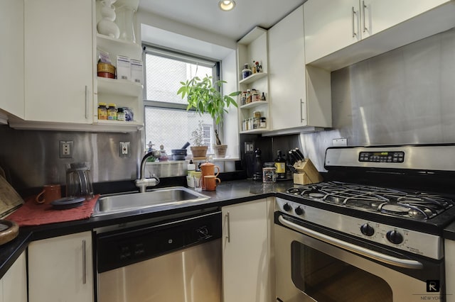 kitchen with a sink, stainless steel appliances, open shelves, white cabinetry, and dark countertops