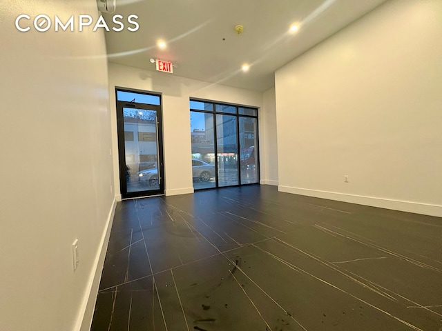 empty room with baseboards