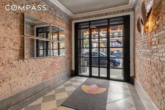 doorway featuring ornamental molding and baseboards