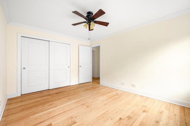 273 Bennett Ave Unit 5-G, New York City, NY 10040 - unfurnished bedroom with baseboards, wood finished floors, crown molding, a closet, and a ceiling fan