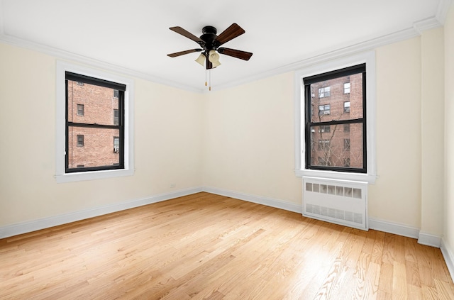 273 Bennett Ave Unit 5-G, New York City, NY 10040 - unfurnished room with radiator, wood finished floors, baseboards, crown molding, and ceiling fan