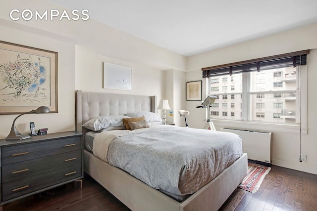 520 E 76th St Phc, Phc, New York City, NY 10021 - bedroom with radiator and dark wood finished floors