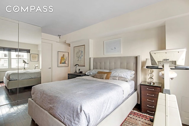 520 E 76th St Phc, Phc, New York City, NY 10021 - bedroom featuring a closet and dark wood-type flooring