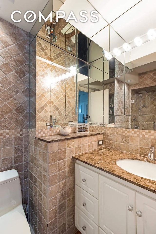 520 E 76th St Phc, Phc, New York City, NY 10021 - bathroom with tile walls, vanity, and tiled shower