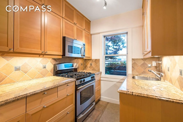 520 E 76th St Phc, Phc, New York City, NY 10021 - kitchen featuring stainless steel appliances, tasteful backsplash, and light stone counters