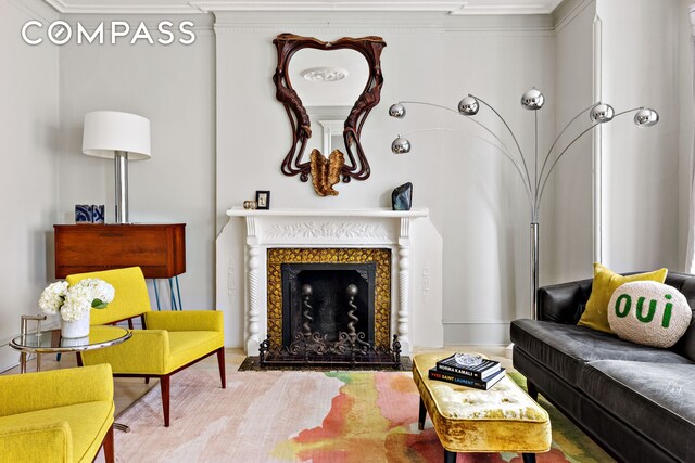 living area featuring a fireplace with flush hearth