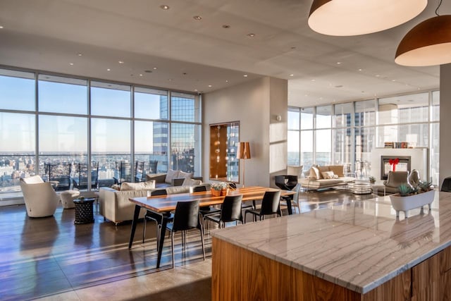 lobby with expansive windows, a high ceiling, and recessed lighting