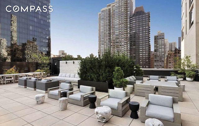 401 E 60th St Unit 35B, New York City, NY 10022 - view of patio / terrace featuring an outdoor living space and a skyline view