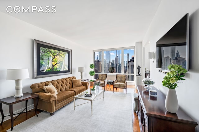 401 E 60th St Unit 35B, New York City, NY 10022 - living room with light wood-style floors