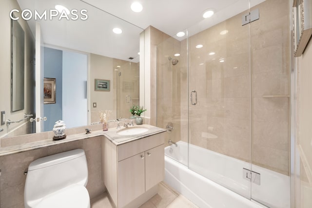 401 E 60th St Unit 35B, New York City, NY 10022 - bathroom featuring vanity, shower / bath combination with glass door, and recessed lighting