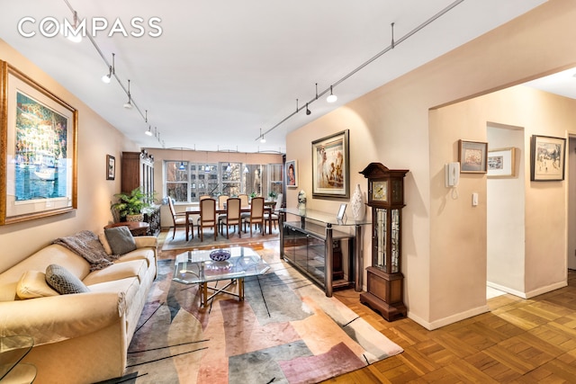 80 E End Ave Unit 3Hj, New York City, NY 10028 - living area featuring rail lighting and baseboards