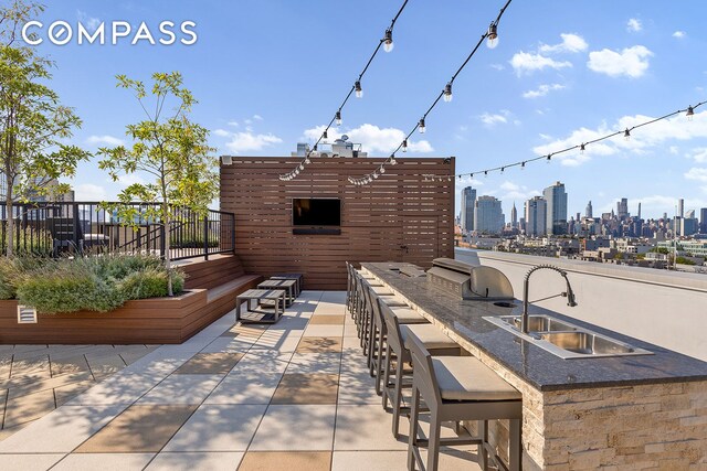 171 N 1st St Unit 3K, New York City, NY 11211 - view of patio / terrace with an outdoor kitchen and a view of skyline