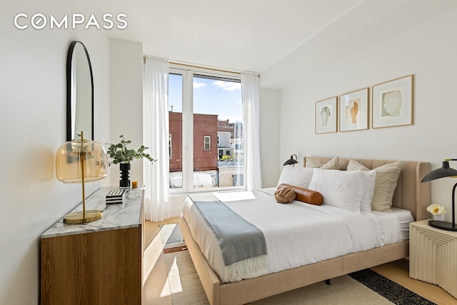 171 N 1st St Unit 3K, New York City, NY 11211 - bedroom with access to exterior and wood finished floors