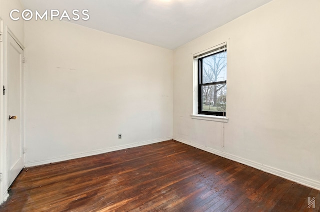 22-60 79th St Unit 1A, New York City, NY 11370 - spare room with dark wood finished floors and baseboards