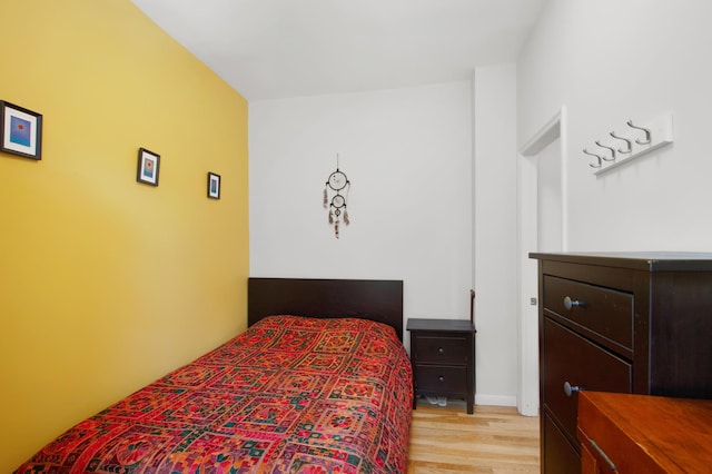 327 E 3rd St Unit 1-E, New York City, NY 10009 - bedroom with light wood-type flooring