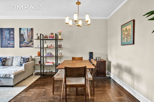 dining area with baseboards, an inviting chandelier, and crown molding