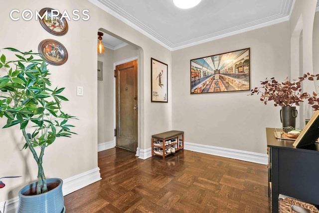hall with baseboards and ornamental molding