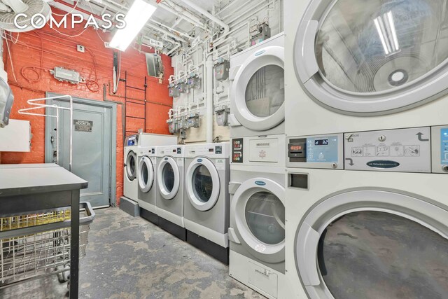 255 W 23rd St Unit 5Gw, New York City, NY 10011 - common laundry area with stacked washer / drying machine