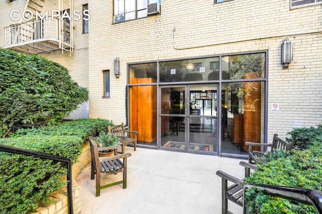 entrance to property with brick siding