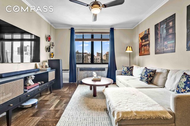 255 W 23rd St Unit 5Gw, New York City, NY 10011 - living area featuring a view of city, radiator heating unit, ceiling fan, and ornamental molding
