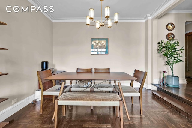 dining space with an inviting chandelier, ornamental molding, and baseboards