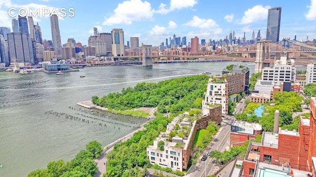 aerial view featuring a water view and a city view