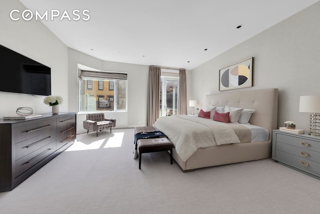 bedroom featuring light carpet