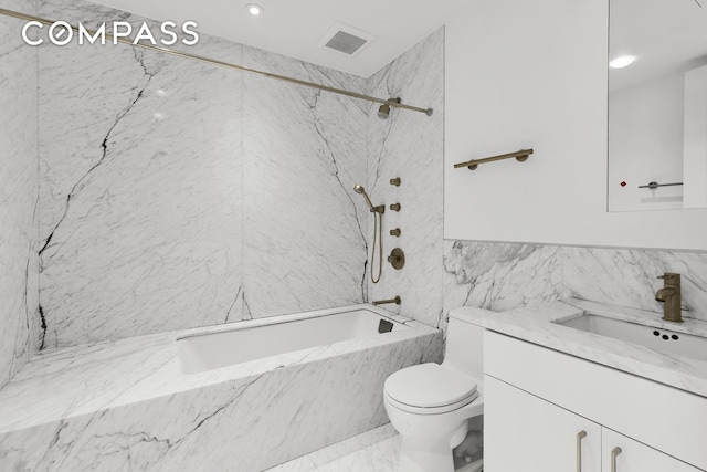full bathroom with vanity, toilet, tile walls, visible vents, and a combined bath / shower with marble appearance