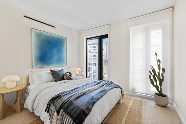 bedroom featuring wood finished floors