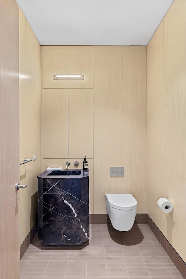 bathroom with tile patterned floors and toilet