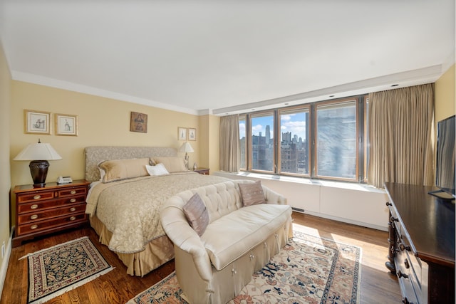 45 E 80th St Unit 17B, New York City, NY 10075 - bedroom featuring wood finished floors and ornamental molding