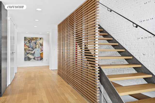 53 Crosby St Unit 1, New York City, NY 10012 - hallway with visible vents, light wood-style floors, stairway, and recessed lighting