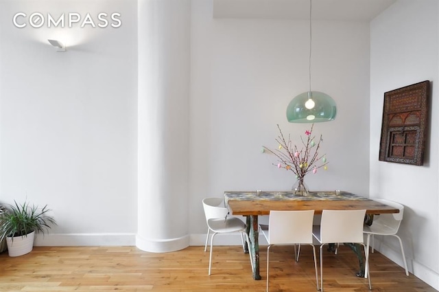 360 Furman St Unit 511, New York City, NY 11201 - dining area featuring baseboards and wood finished floors