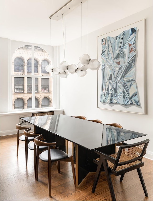 391 Broadway Loftc, New York City, NY 10013 - dining room featuring light wood-style floors and baseboards