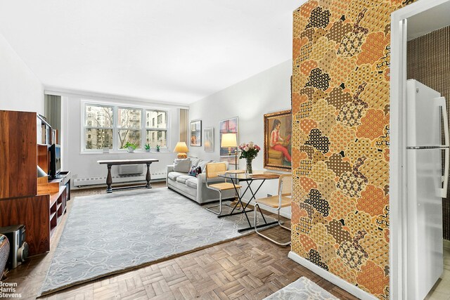 living area with baseboard heating