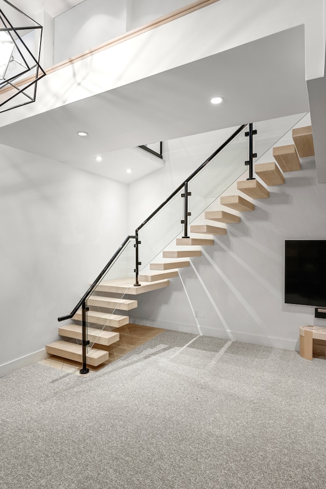 stairway featuring recessed lighting, carpet, and baseboards