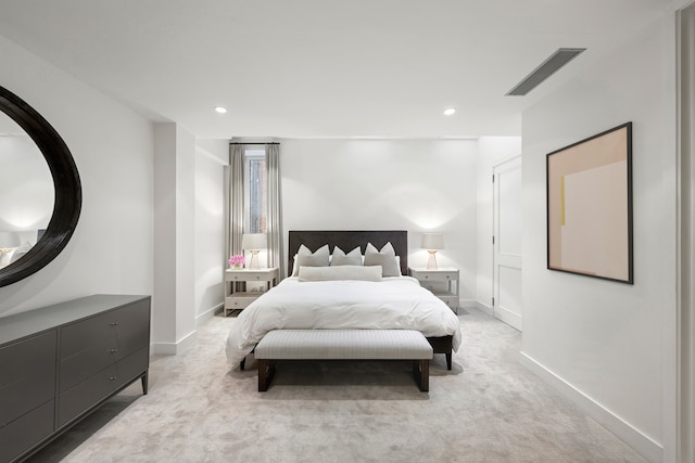 bedroom with recessed lighting, visible vents, light carpet, and baseboards