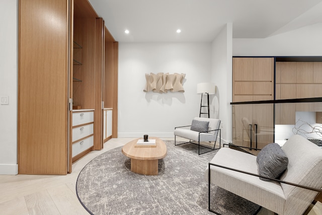 living area with recessed lighting and baseboards