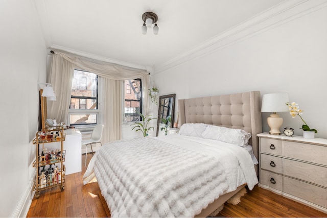 205 E 10th St Unit 2B, New York City, NY 10003 - bedroom with dark wood-style floors and crown molding