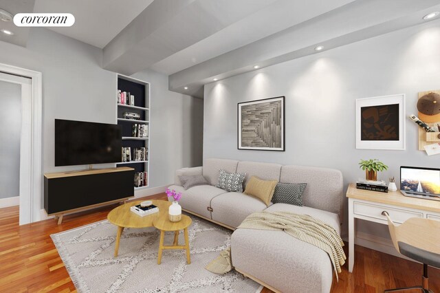 living room with recessed lighting, baseboards, visible vents, built in features, and wood finished floors