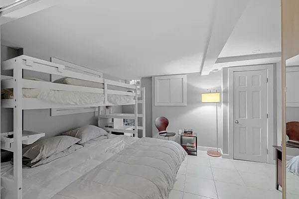 bedroom featuring light tile patterned floors