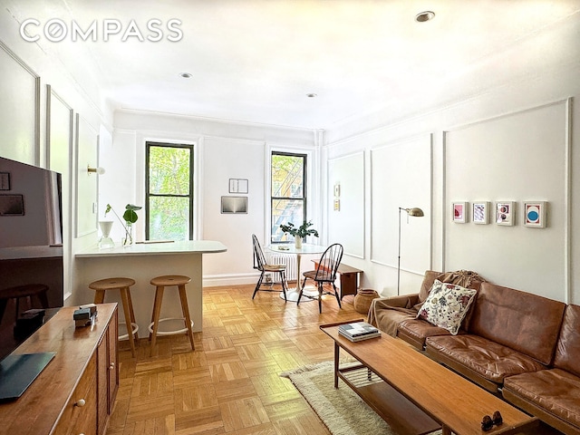 living room featuring a decorative wall